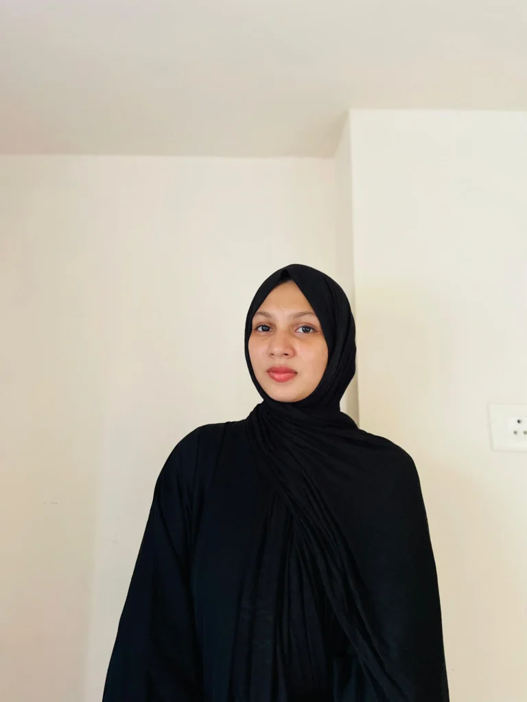 Best freelance digital marketer in Malappuram standing against a white background wearing a black outfit